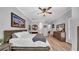 Spacious main bedroom with a light wood floor and access to main bathroom at 15507 Avocetview Ct, Lithia, FL 33547