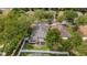 Home with a screened-in patio and fenced backyard in a wooded neighborhood at 16905 Hawkridge Rd, Lithia, FL 33547