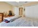 Bright bedroom with a ceiling fan, large closet, and view of the hallway at 16905 Hawkridge Rd, Lithia, FL 33547