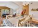 Inviting dining room showcasing a beautiful table set, hardwood floors, and an open floor plan at 16905 Hawkridge Rd, Lithia, FL 33547