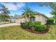 Exterior of the home shows lush landscaping at 16905 Hawkridge Rd, Lithia, FL 33547