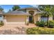 Charming single-Gathering home with a well-manicured lawn and a two-car garage at 16905 Hawkridge Rd, Lithia, FL 33547