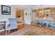 Living room featuring hardwood floors and opening into the dining room and entryway at 16905 Hawkridge Rd, Lithia, FL 33547