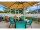 Back patio with outdoor seating for relaxing and entertaining at 16905 Hawkridge Rd, Lithia, FL 33547