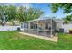 Screened-in patio provides a view of the backyard at 16905 Hawkridge Rd, Lithia, FL 33547