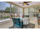 Sunroom with lots of windows and an inviting table setting at 16905 Hawkridge Rd, Lithia, FL 33547