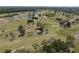 Scenic aerial view of the golf course featuring lush fairways, mature trees, and tranquil water features at 1817 Golfview Dr # 1817, Tarpon Springs, FL 34689