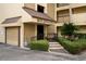 Welcoming entrance to 1800 Golfview Drive with well-manicured landscaping, convenient seating, and ample parking at 1817 Golfview Dr # 1817, Tarpon Springs, FL 34689