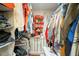 Walk-in closet with ample shelving and storage, maximizing space and organization at 1817 Golfview Dr # 1817, Tarpon Springs, FL 34689