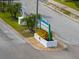 Welcoming community sign surrounded by flowering plants at 1817 Golfview Dr # 1817, Tarpon Springs, FL 34689