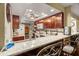 Kitchen with granite countertops, stainless steel appliances, and a breakfast bar at 1817 Golfview Dr # 1817, Tarpon Springs, FL 34689