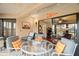 Relaxing lanai space with cozy seating and open layout to the home's interior at 1817 Golfview Dr # 1817, Tarpon Springs, FL 34689