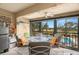 Enclosed lanai with comfortable seating and view of community pool at 1817 Golfview Dr # 1817, Tarpon Springs, FL 34689
