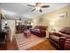Inviting living room with wood floors, and open floorplan to dining area at 1817 Golfview Dr # 1817, Tarpon Springs, FL 34689