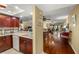 Open concept living spaces including dining, kitchen, and living room with hardwood floors at 1817 Golfview Dr # 1817, Tarpon Springs, FL 34689