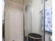 Shower with framed glass doors at 1817 Golfview Dr # 1817, Tarpon Springs, FL 34689