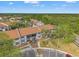 An aerial view showcases the complex with its lush surroundings, close to water, and easy access to parking at 1930 Laughing Gull Ln # 1225, Clearwater, FL 33762
