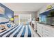 Comfortable bedroom featuring coastal-themed décor, a seating area and plenty of natural light at 1930 Laughing Gull Ln # 1225, Clearwater, FL 33762