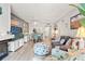 Spacious living room featuring coastal-themed décor, comfortable seating, and a dining area with a view at 1930 Laughing Gull Ln # 1225, Clearwater, FL 33762