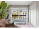 A bright room shows sliding glass doors to a patio, and a closet at 1930 Laughing Gull Ln # 1225, Clearwater, FL 33762