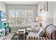 Cozy seating area with comfortable striped chairs, shutters and nautical décor at 1930 Laughing Gull Ln # 1225, Clearwater, FL 33762