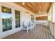 Cozy balcony featuring comfortable seating, wood flooring, and a relaxing atmosphere at 216 Pine Ave # R, Anna Maria, FL 34216