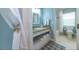 Stylish bathroom featuring a granite vanity, neutral tones, and a shower/tub combo at 216 Pine Ave # R, Anna Maria, FL 34216
