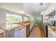 Spacious kitchen with white cabinets, granite countertops and stainless steel appliances at 216 Pine Ave # R, Anna Maria, FL 34216