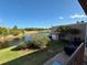 Scenic backyard view with water feature, lush landscaping, and a patio, perfect for relaxation at 225 Country Club Dr # A207, Largo, FL 33771