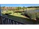 Overlooking the backyard with a peaceful pond view from the balcony at 225 Country Club Dr # A207, Largo, FL 33771
