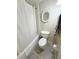 Cozy bathroom featuring a bathtub with shower and standard white toilet at 225 Country Club Dr # A207, Largo, FL 33771