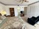 Bedroom featuring large wardrobe, ceiling fan, and access to the bathroom at 225 Country Club Dr # A207, Largo, FL 33771