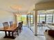 Open concept dining area with large windows providing ample light and views, perfect for entertaining at 225 Country Club Dr # A207, Largo, FL 33771