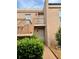 Inviting condominium building with stairs leading to upper-level units and well-maintained landscaping at 225 Country Club Dr # A207, Largo, FL 33771