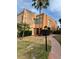 Attractive multi-level home with mature landscaping and a walkway leading to the front entrance at 225 Country Club Dr # A207, Largo, FL 33771
