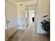 Hallway featuring tile entry, carpeting, and view to the living area at 225 Country Club Dr # A207, Largo, FL 33771