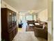 Open living area with a view of the lanai, complete with stylish furnishings at 225 Country Club Dr # A207, Largo, FL 33771