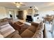 Cozy living room featuring comfortable sofas, a ceiling fan, and an adjacent dining area at 225 Country Club Dr # A207, Largo, FL 33771