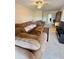 Inviting living room with comfortable seating, neutral carpet, and an entertainment center at 225 Country Club Dr # A207, Largo, FL 33771