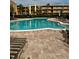 Enjoy the outdoors at this community pool that is surrounded by lush greenery, lounge chairs, and well-maintained landscaping at 225 Country Club Dr # A207, Largo, FL 33771