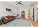 Bright bedroom with a comfortable sofa and a large patterned rug, perfect for relaxing at 2402 W Parkland Blvd, Tampa, FL 33609
