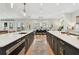 Expansive kitchen featuring dual islands, modern appliances, and seamless transition to the dining space at 2402 W Parkland Blvd, Tampa, FL 33609