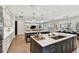 Open kitchen with dual islands, seamless flow to living spaces, and bright, airy design at 2402 W Parkland Blvd, Tampa, FL 33609