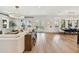 Open concept living room and dining area with hardwood floors and abundant natural light at 2402 W Parkland Blvd, Tampa, FL 33609