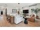 Spacious living room with hardwood floors, stylish lighting, and comfortable seating arrangement at 2402 W Parkland Blvd, Tampa, FL 33609