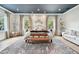 Calm main bedroom features a sitting area, neutral tones, and natural light from windows at 2402 W Parkland Blvd, Tampa, FL 33609