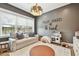 Playroom featuring a comfortable sofa, a large window, and decor at 2402 W Parkland Blvd, Tampa, FL 33609