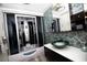 Modern bathroom featuring a glass-enclosed shower and a vessel sink with designer tile backsplash at 2460 Beacon Groves Blvd, Palm Harbor, FL 34683