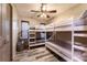 Bedroom with three twin sized bunkbeds and wood flooring at 2460 Beacon Groves Blvd, Palm Harbor, FL 34683