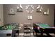 Entertainment filled game room with foosball and ping pong tables; wall art at 2460 Beacon Groves Blvd, Palm Harbor, FL 34683